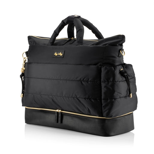 a black handbag with gold handles and handles