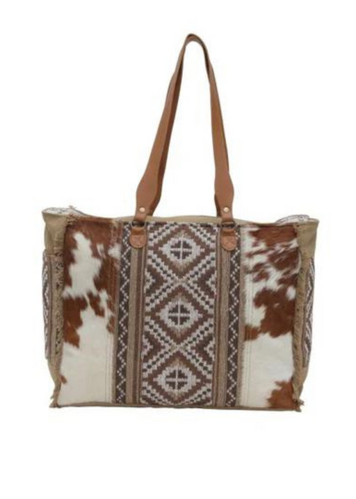 a brown and white tote bag with a pattern on it
