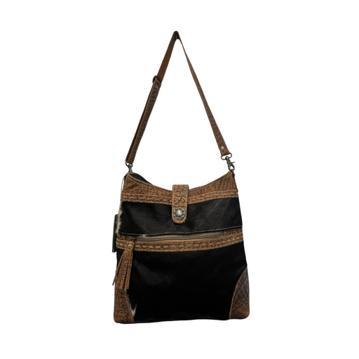 a black and brown purse on a white background