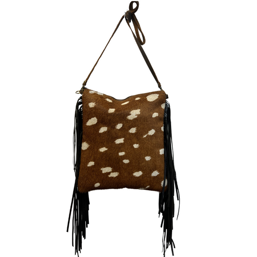 a brown and white spotted bag hanging from a hook