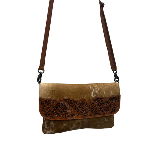 a brown and tan purse with a brown strap