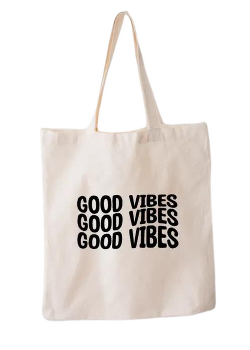 a white tote bag with good vibes written on it