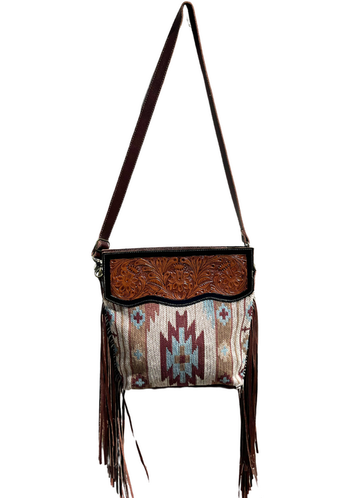 a purse with fringes hanging from it