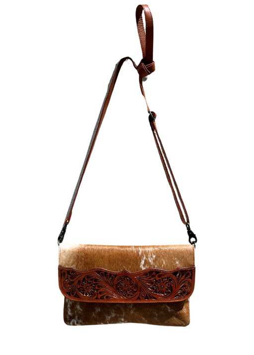 a brown and white purse with a brown strap