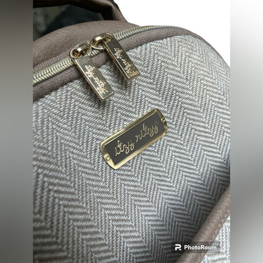 a close up of a bag with a name tag on it