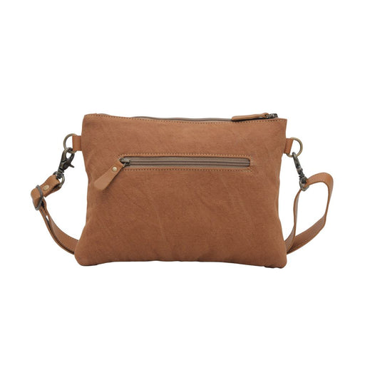 a brown cross body bag on a white background