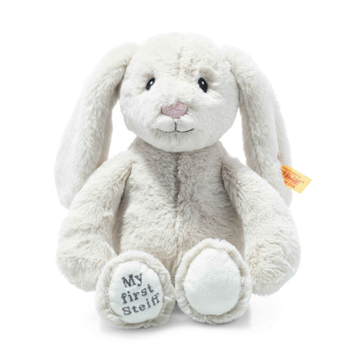 a white stuffed rabbit with a tag on its ear