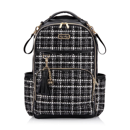 a black and white backpack with a tassel