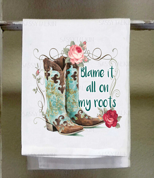 a tea towel with a pair of cowboy boots on it