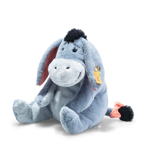 a blue stuffed animal with a tag on its ear
