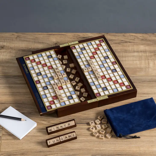 a game of scrabble on a wooden table