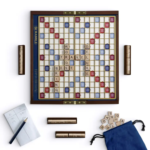a game of scrabble with a blue bag and several pieces of scra