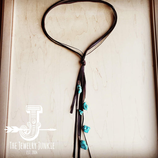 a necklace with a tassel hanging from it