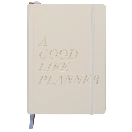 a good life planner in a white notebook