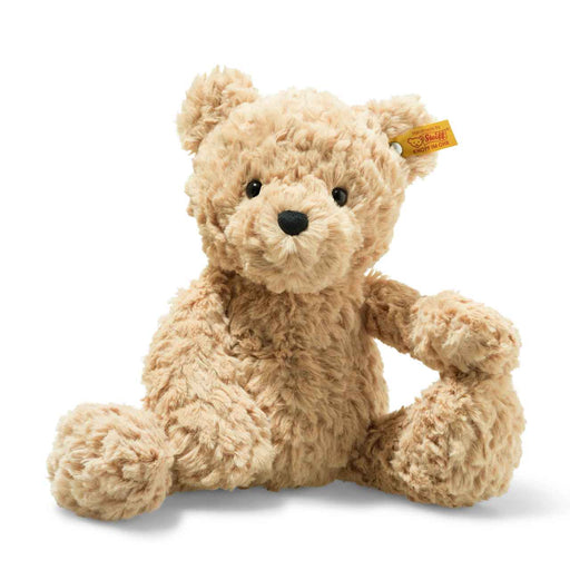 a brown teddy bear with a tag on its ear