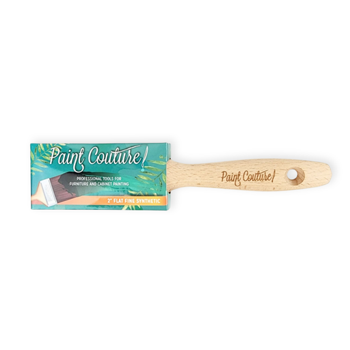 a wooden paint brush with a label on it