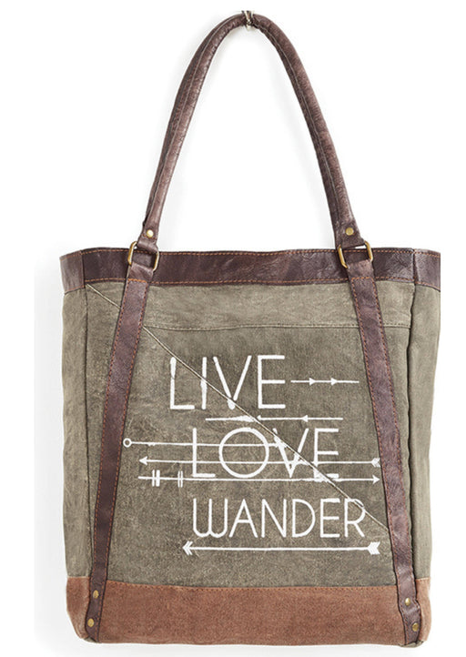 a canvas tote bag with a brown leather handle and the words live, love, wander on it