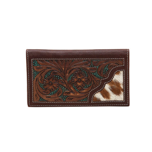 a brown wallet with a cow print on it