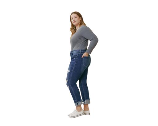a woman standing with her hands on her hips wearing plus size women's blue jeans