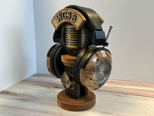 an old-fashioned headphone stand on a wood table