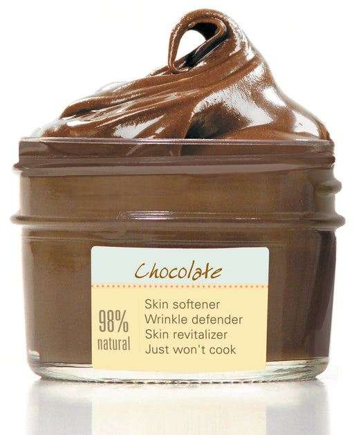 a jar of chocolate spread on a white surface