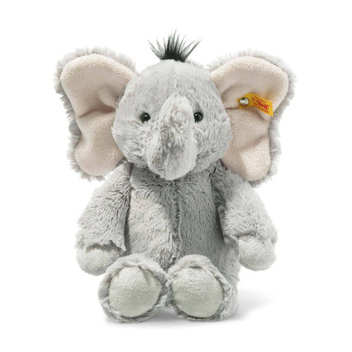 a stuffed elephant with a tag on its ear