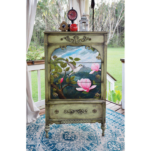 A chest of drawers with rice paper applique of bird and spring magnolias