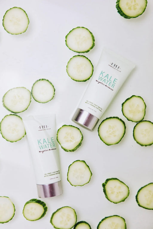 a tube of kale water moisturizer next to a tube of cucumber