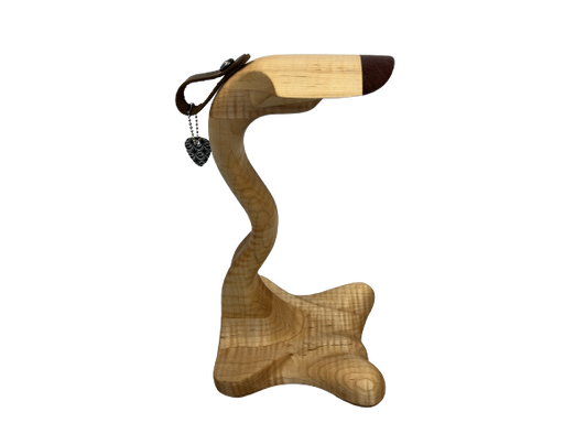 a wooden headphone stand with a guitar pic attached to it