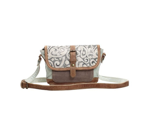 a white and brown purse on a white background