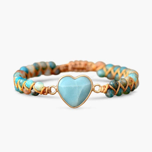 a handcrafted bracelet with a blue amazonite heart on it