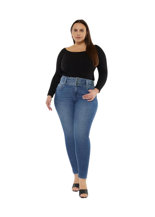 a woman in a black top and jeans