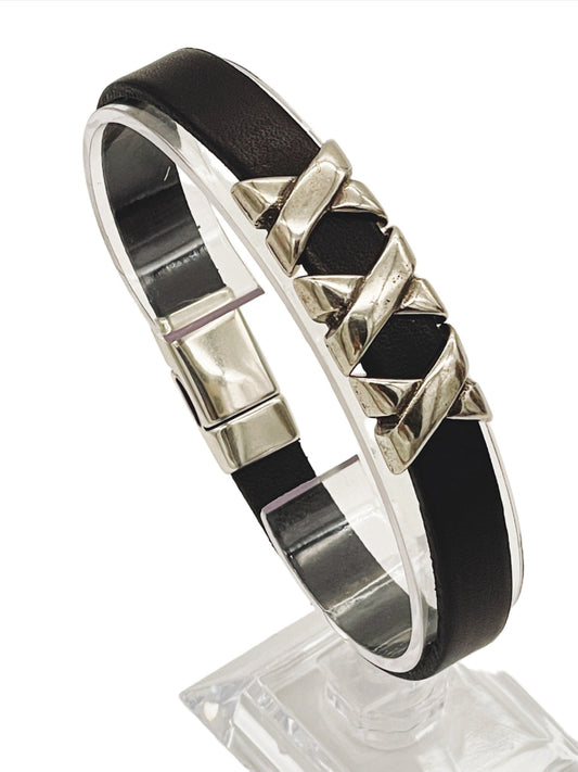 a black and silver bracelet with pyramids on it