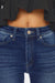 a close up of a woman wearing jeans