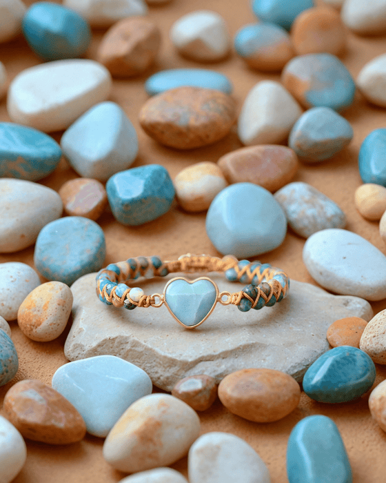 a close up of a bracelet with a heart on it