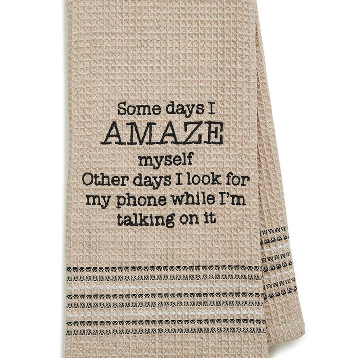 a taupe towel that says Some days I amaze myself Other days I look for my phone while I'm talking on it