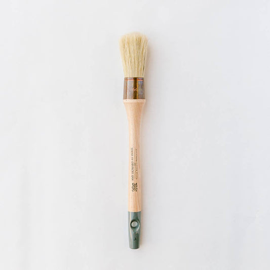 a paint brush on a white background