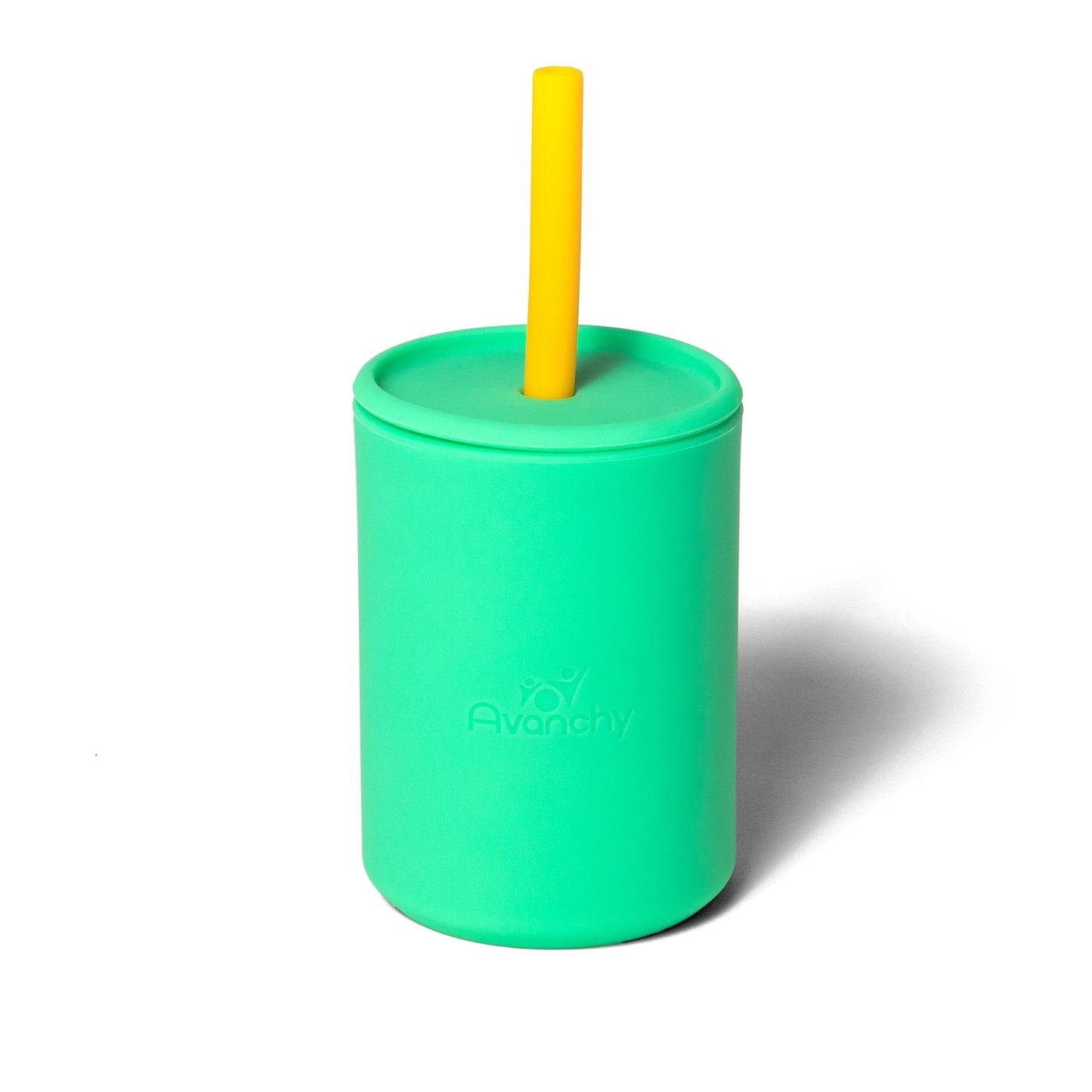 a green cup with a yellow straw sticking out of it