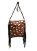 a brown and white spotted purse hanging from a hook