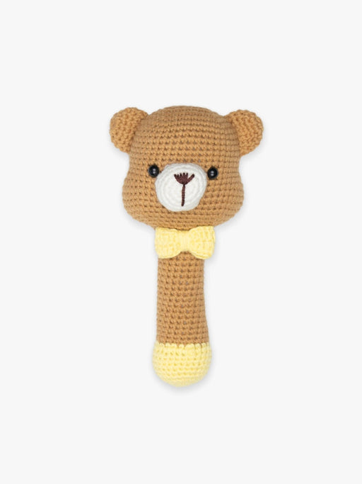 a brown teddy bear rattle with a yellow bow tie. 