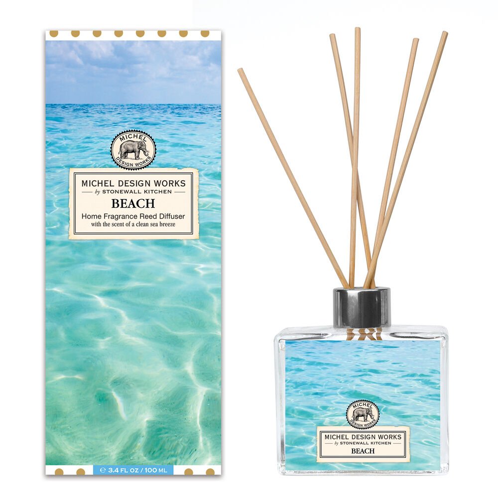 Michel Design Works beach-themed reed diffuser with a clear glass decanter and bamboo reeds, featuring a serene ocean design that evokes a calming coastal atmosphere.