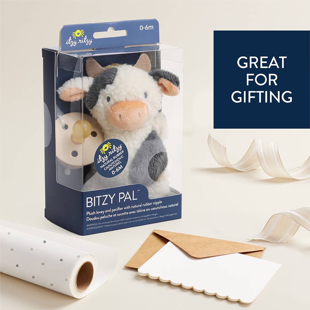 a stuffed animal in a packaging with a tag