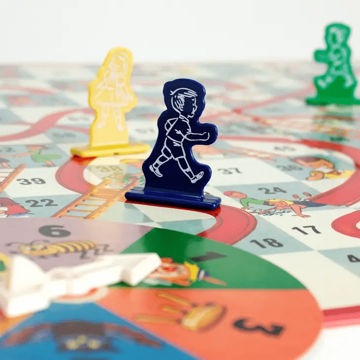 a close up of a board game with a person on it