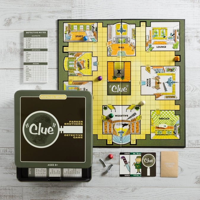 a clue board and a game board on a table