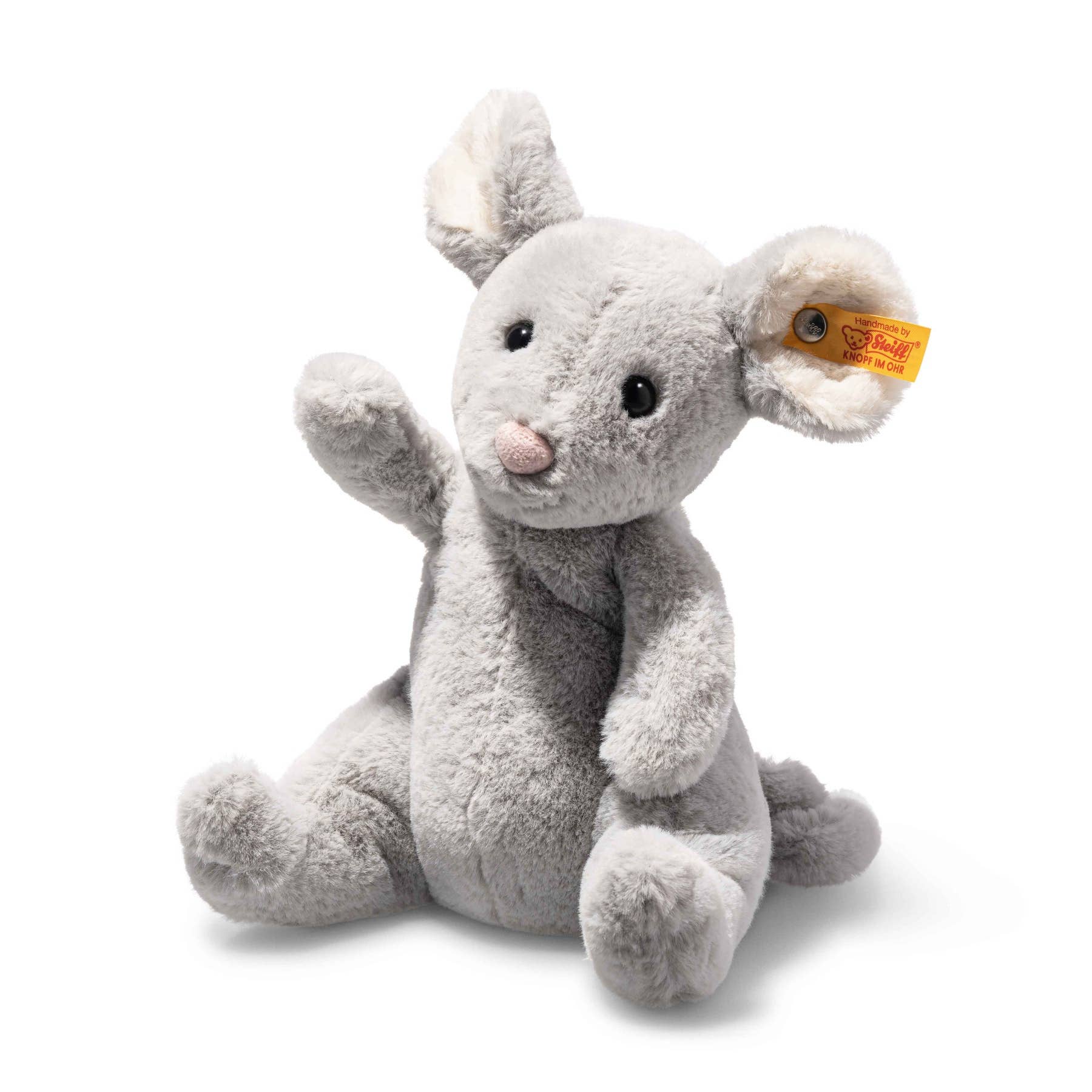 a gray stuffed animal with a tag on its ear