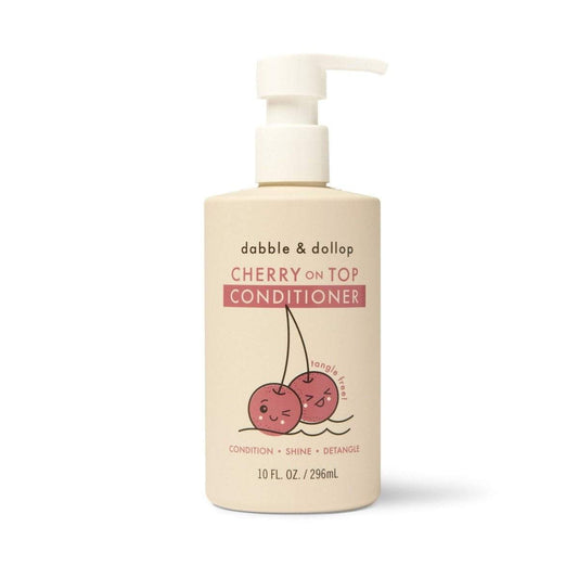 a bottle of conditioner with cherries on it