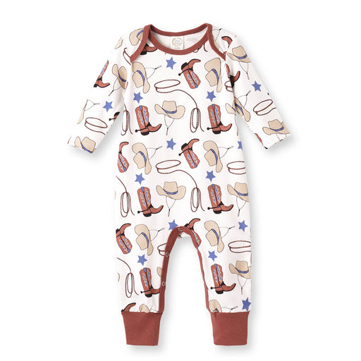 a baby sleepsuit with cowboy boots and stars on it