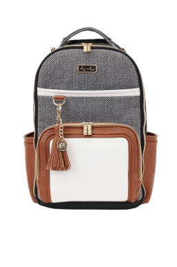 a gray and white backpack with a tassel