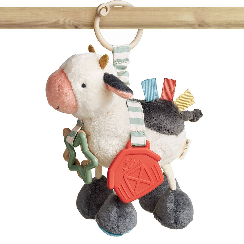 a stuffed animal hanging from a wooden pole