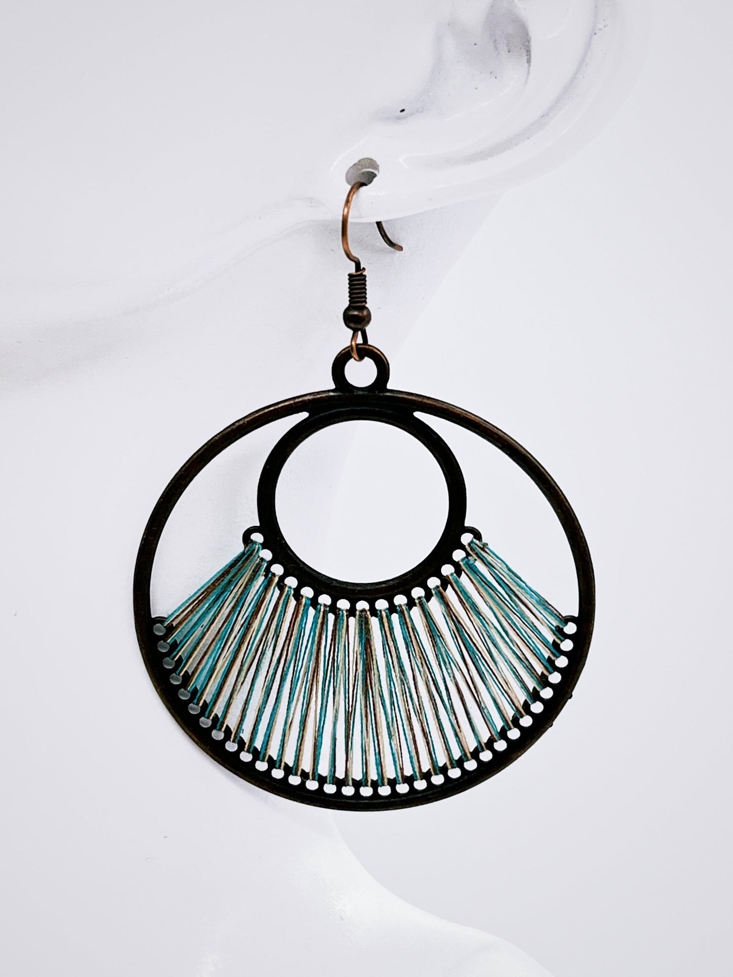 Denim Blue Fan Woven Hoop Earring on mannequin display